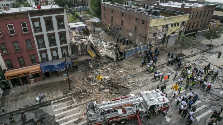 A four-story building at 1438 Fulton St. in the Bed-Stuy section of Brooklyn, collapsed just before 2:30 p.m. on Tuesday, July 14, 2014. The FDNY says at least three passers-by were treated for non-life-threatening injuries after being hit by fallen debris.