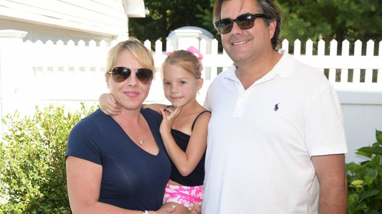 Regina Quinn, Emma Quinn and Charles Regensburg at the Last Chance Animal Rescue benefit hosted by Ruth Katz on July 11, 2015, in Bridgehampton.