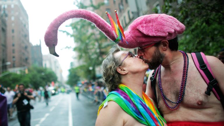 Lee Hencen, left, and Murray Schechter kiss during the Pride March on June 28, 2015 in New York City. 