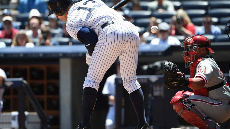 Yankees vs. Phillies 33 New York Yankees designated hitter Alex Rodriguez reacts after he is hit by a pitch by Philadelphia Phillies starting pitcher Cole Hamels during the first inning of a game at Yankee Stadium on Wednesday, June 24, 2015.