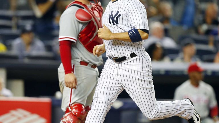 Yankees vs. Phillies 38 Carlos Beltran #36 of the New York Yankees scores a fifth-inning game-tying run past Cameron Rupp #29 of the Philadelphia Phillies at Yankee Stadium on Tuesday, June 23, 2015.