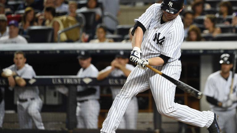Yankees vs. Phillies 54 New York Yankees catcher Brian McCann hits a home run against the Philadelphia Phillies during the seventh inning of a baseball game at Yankee Stadium on Monday, June 22, 2015.