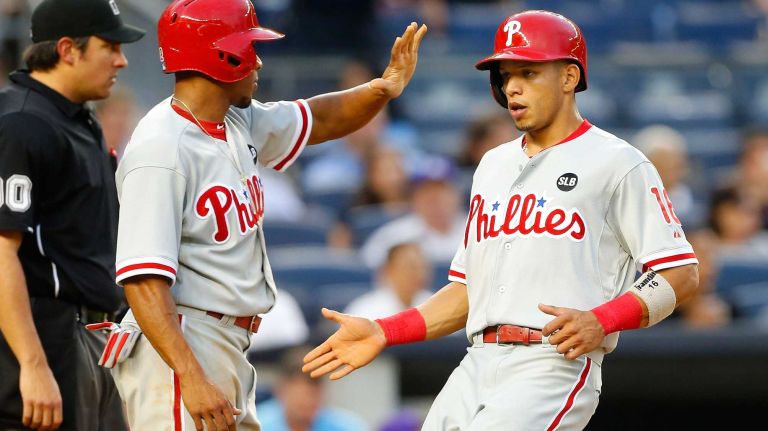 Yankees vs. Phillies 56 Cesar Hernandez #16 and Ben Revere #2 of the Philadelphia Phillies score in the third inning against the New York Yankees after a base hit from teammate Ryan Howard (not pictured) at Yankee Stadium on June 22, 2015.