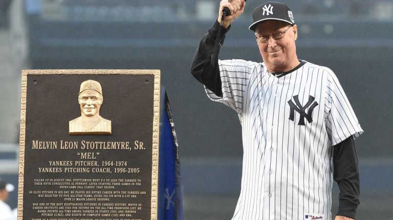 Former New York Yankees pitcher and pitching coach Mel Stottlemyre acknowledges the fans as he stands next to his Monument Park plaque during the 69th Old-Timers' Day at Yankee Stadium before a baseball game between the Yankees and the Detroit Tigers on Saturday, June 20, 2015.