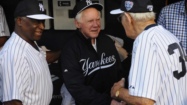 From left: Former New York Yankees Al Downing, Whitey Ford and Jim Coates talk in the dugout during the 69th Old-Timers' Day at Yankee Stadium before a baseball game between the Yankees and the Detroit Tigers on Saturday, June 20, 2015.