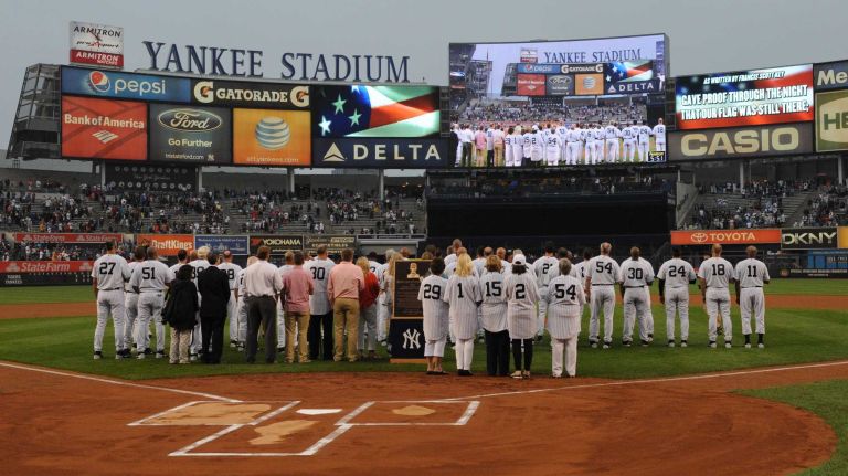 Former New York Yankees players and wives stand on the field during the 69th Old-Timers' Day at Yankee Stadium before a baseball game between the Yankees and the Detroit Tigers on Saturday, June 20, 2015.