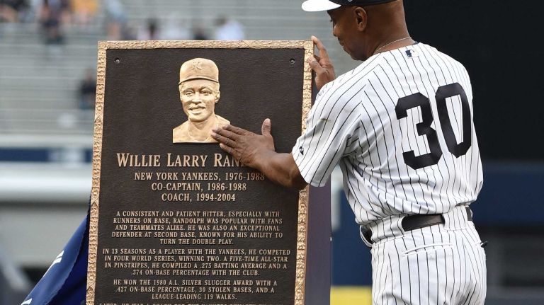Former New York Yankee Willie Randolph admires his Monument Park plaque during the 69th Old-Timers' Day at Yankee Stadium before a baseball game between the Yankees and the Detroit Tigers on Saturday, June 20, 2015.