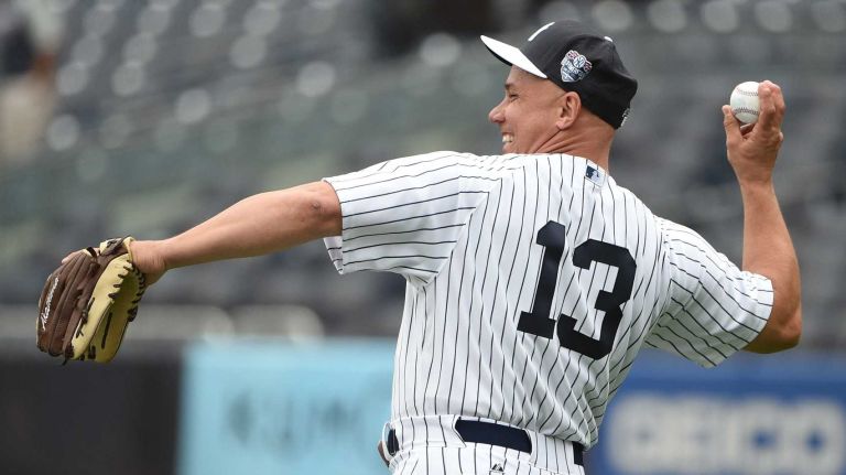 Former New York Yankees Jim Leyritz throws a baseball at batting practice during the 69th Old-Timers' Day at Yankee Stadium before a baseball game between the Yankees and the Detroit Tigers on Saturday, June 20, 2015.