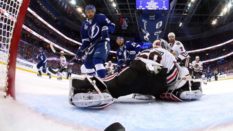 TAMPA, FL - JUNE 06: Cedric Paquette #13 of the Tampa Bay Lightning scores a first period goal against Corey Crawford #50 of the Chicago Blackhawks during Game Two of the 2015 NHL Stanley Cup Final at Amalie Arena on June 6, 2015 in Tampa, Florida. (Photo by Bruce Bennett/Getty Images)