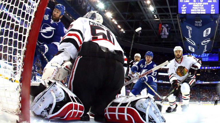 TAMPA, FL - JUNE 06: Corey Crawford #50 of the Chicago Blackhawks makes a save against the Tampa Bay Lightning during the first period in Game Two of the 2015 NHL Stanley Cup Final at Amalie Arena on June 6, 2015 in Tampa, Florida. (Photo by Bruce Bennett/Getty Images)
