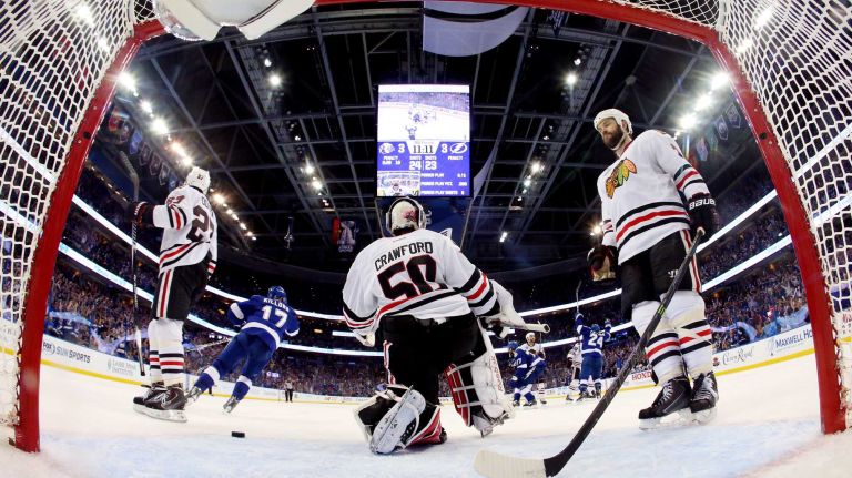 TAMPA, FL - JUNE 06: Corey Crawford #50 of the Chicago Blackhawks gives up a third period goal to Jason Garrison #5 of the Tampa Bay Lightning during Game Two of the 2015 NHL Stanley Cup Final at Amalie Arena on June 6, 2015 in Tampa, Florida. (Photo by Bruce Bennett/Getty Images)