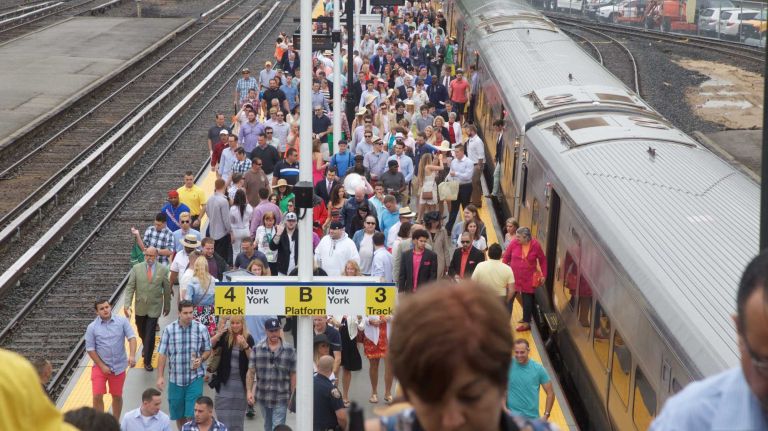 People arrive from the Long Island Rail Road before the 147th running of the Belmont Stakes at Belmont Park in Elmont, Saturday, June 6, 2015.