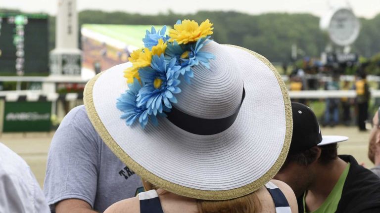 A woman faces the track by the finish line at Belmont Park on Saturday morning before the 147th running of the Belmont Stakes on June 6, 2015, in Elmont.