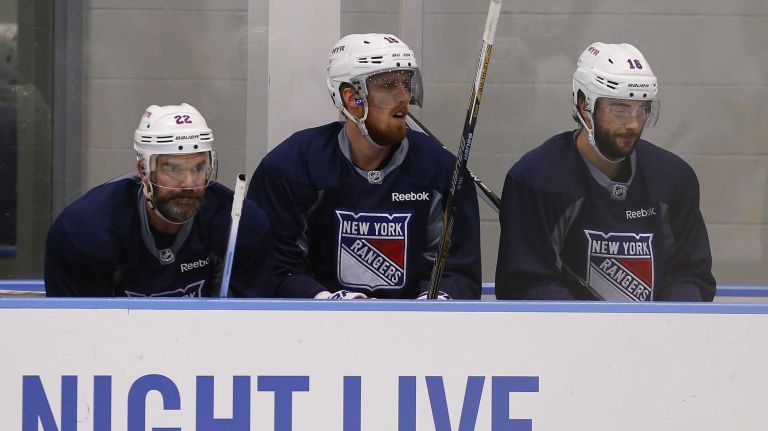 Dan Boyle, Marc Staal and Derick Brassard of the Rangers watch practice from the bench on Thursday, May 28, 2015 at the MSG Training Center in Greenburgh, N.Y.
