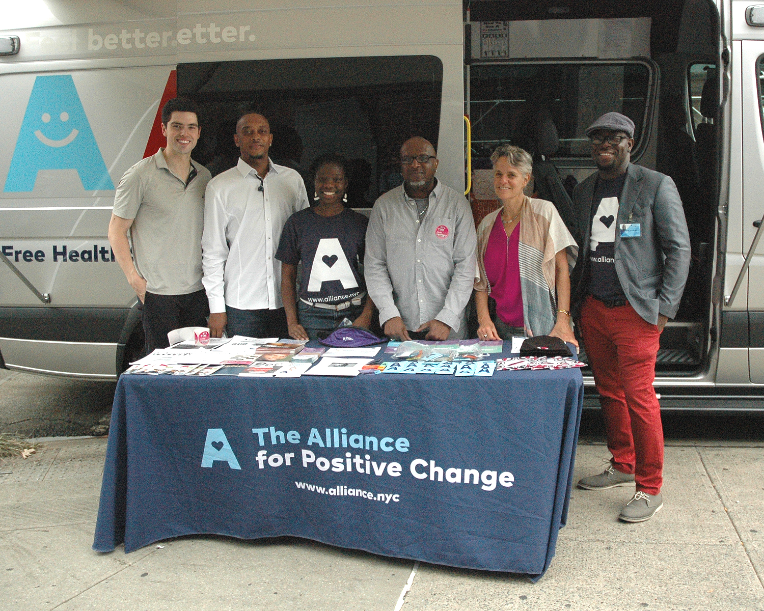 Staff members at the Alliance on the Move bus David Nager:Alliance for Positive Change