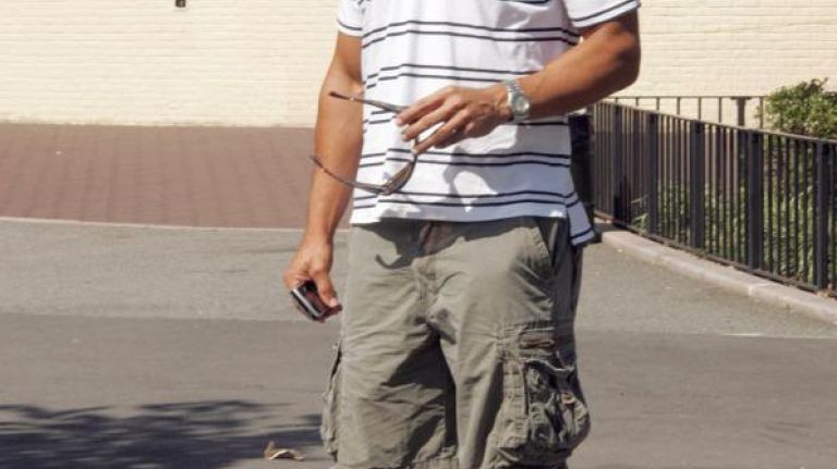Thomas Elgins, Newport Beach, Calif., wears cargo shorts, striped Puma shirt and Bon Zipper sunglasses.