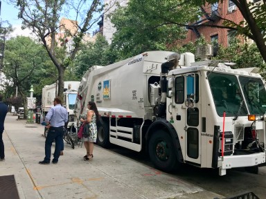 Garbage trucks parked on E. 10 St. on Aug. 18. (Courtesy Carolyn Maloney’s Office)