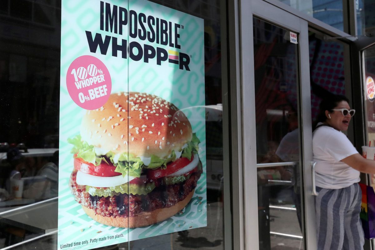 FILE PHOTO: A sign advertising the soy based Impossible Whopper is seen outside a Burger King in New York