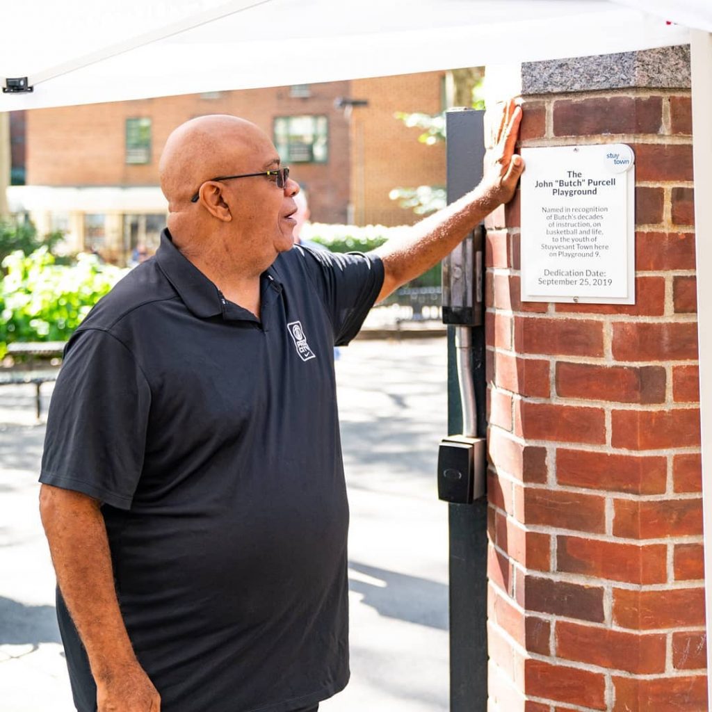 Butch with plaque (Facebook StuyTown)