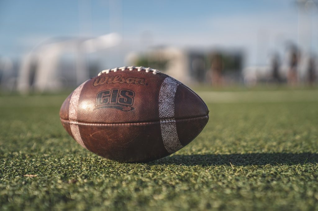selective-focus-close-up-photo-of-brown-wilson-pigskin-2570139