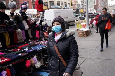 Chinatown residents wear surgical masks in New York City