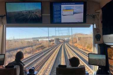 Members of the media ride on Amtrak train during a media tour along northeast rail corridor between Washington DC and New York City