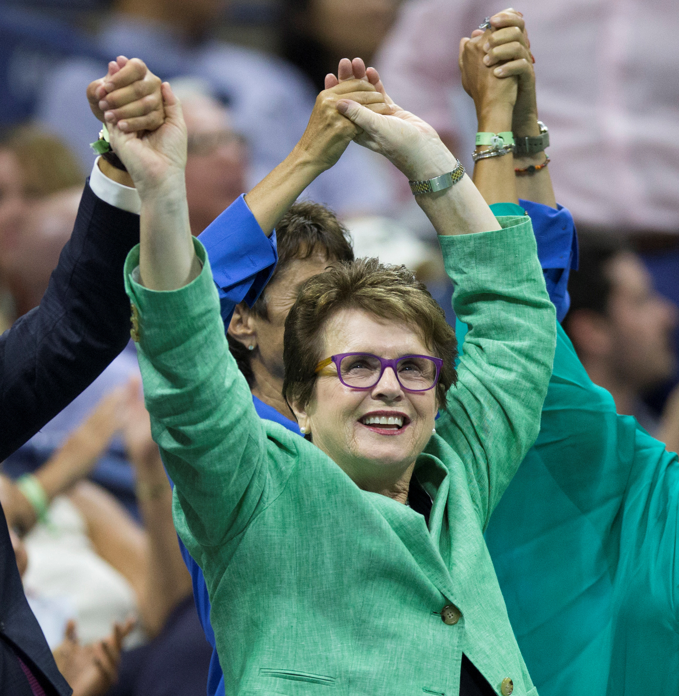 FILE PHOTO: Tennis great Billie Jean King holds hands with other attendees as Serena Williams of the U.S. faces her sister and compatriot Venus Williams in their quarterfinals match at the U.S. Open Championships tennis tournament in New York