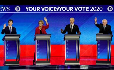 FILE PHOTO: Democratic 2020 U.S. presidential candidates participate in the eighth Democratic 2020 presidential debate at Saint Anselm College in Manchester, New Hampshire, U.S.