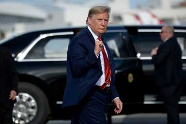 U.S. President Donald Trump walks to Air Force One after the NASCAR Daytona 500 in Daytona Beach