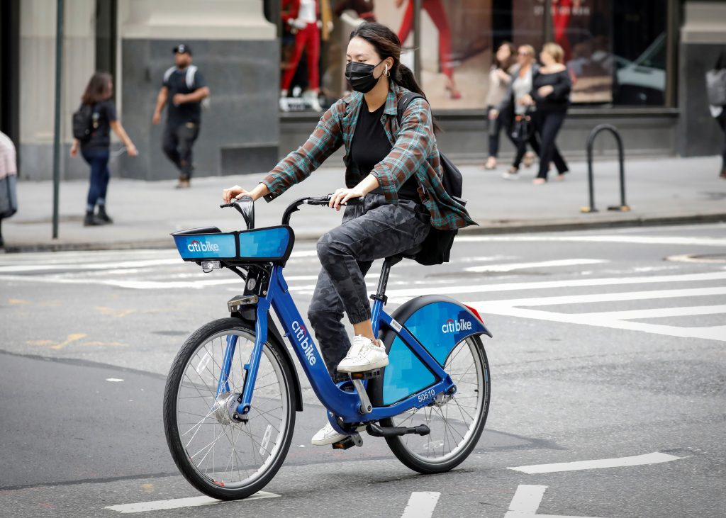 FILE PHOTO: A woman rides a bicycle from bicycle-sharing system Citi Bike in New York City