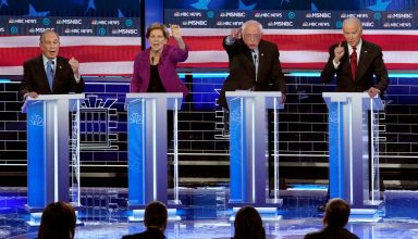 FILE PHOTO: Mike Bloomberg, Elizabeth Warren, Bernie Sanders and Joe Biden (L-R) all speak simultaneously at the ninth Democratic 2020 U.S. Presidential candidates debate at the Paris Theater in Las Vegas