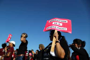 People protest outside the ICE immigration detention center in Adelanto