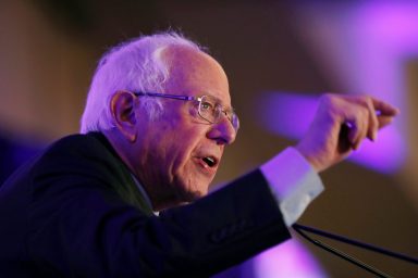 FILE PHOTO: Democratic U.S. presidential candidate Sen. Bernie Sanders speaks with voters at the First in the South Dinner in Charleston