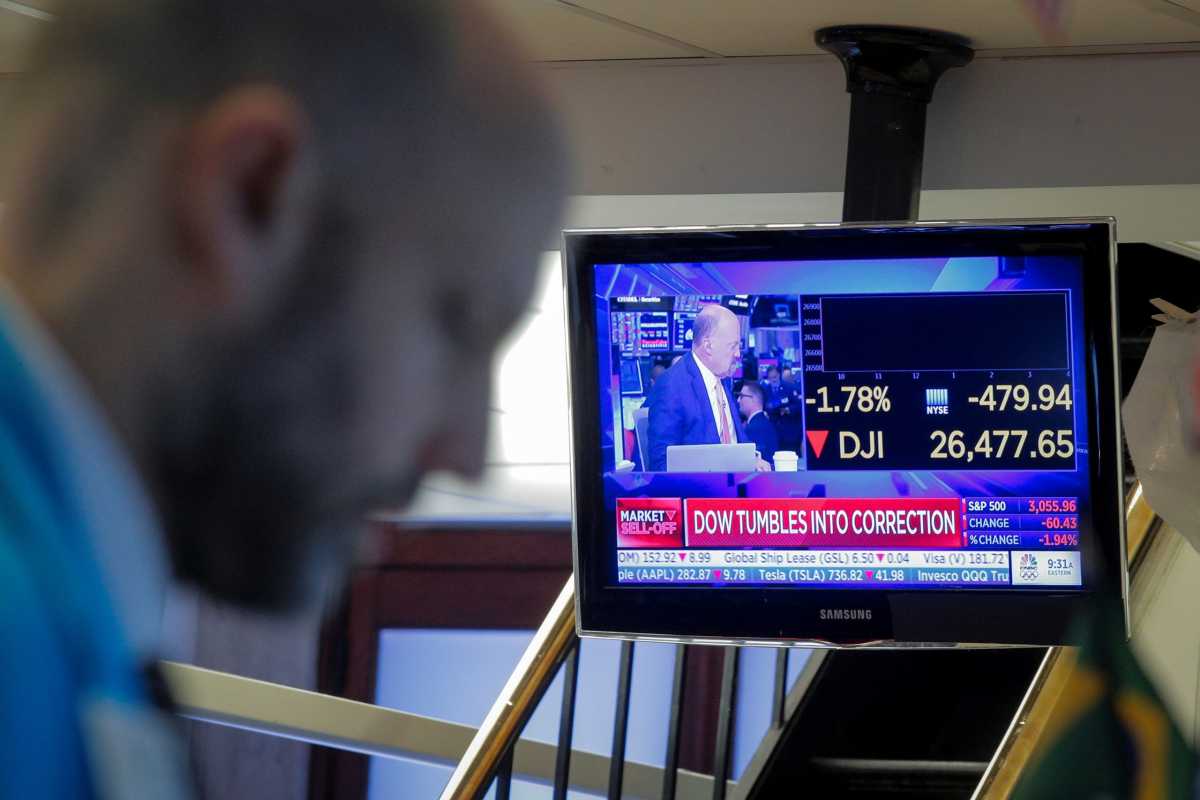 Traders work on the floor at the NYSE in New York