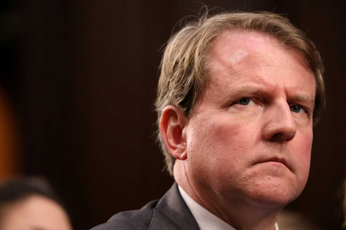 FILE PHOTO: White House Counsel Don McGahn listens during the confirmation hearing for U.S. Supreme Court nominee Kavanaugh on Capitol Hill in Washington