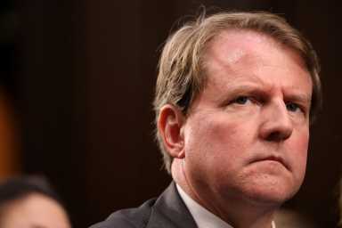 FILE PHOTO: White House Counsel Don McGahn listens during the confirmation hearing for U.S. Supreme Court nominee Kavanaugh on Capitol Hill in Washington