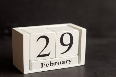 February 29 on a wooden calendar on a dark background .Calendar date, holiday event, or birthday.The last day of the winter month. February 29 happens every four years.