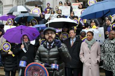 Council Member Francisco Moya speaks Feb. 13 in favor of legislation intended to make it illegal for fast food employers to fire their employees without just cause. (Photo by Grant Lancaster)