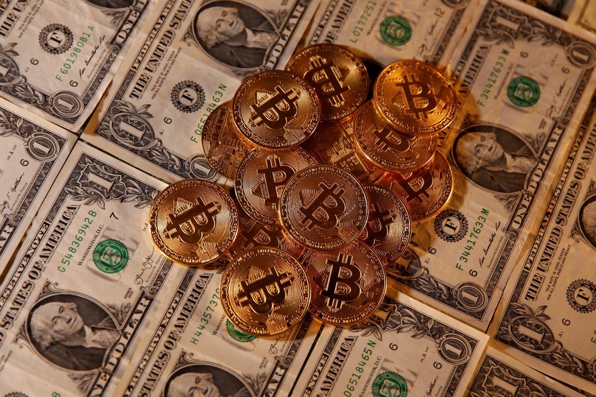 FILE PHOTO: Representations of virtual currency Bitcoin and U.S. dollar banknotes are seen in this picture illustration