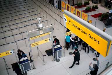 People walk to reach TSA immigration process at the John F. Kennedy International Airport in New York