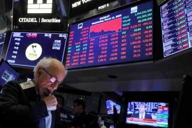 A trader works on the floor of the New York Stock Exchange (NYSE) in New York City