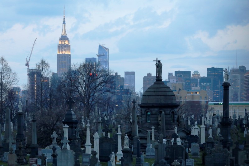 The Manhattan skyline is seen behind the Calvary Cemetery as the coronavirus disease (COVID-19) outbreak continues in the Queens borough of New York City
