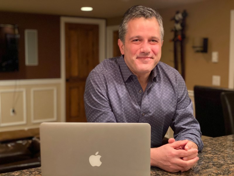 Jonathan Jaffe poses for a photograph in his “man cave” at his Scotch Plains, New Jersey