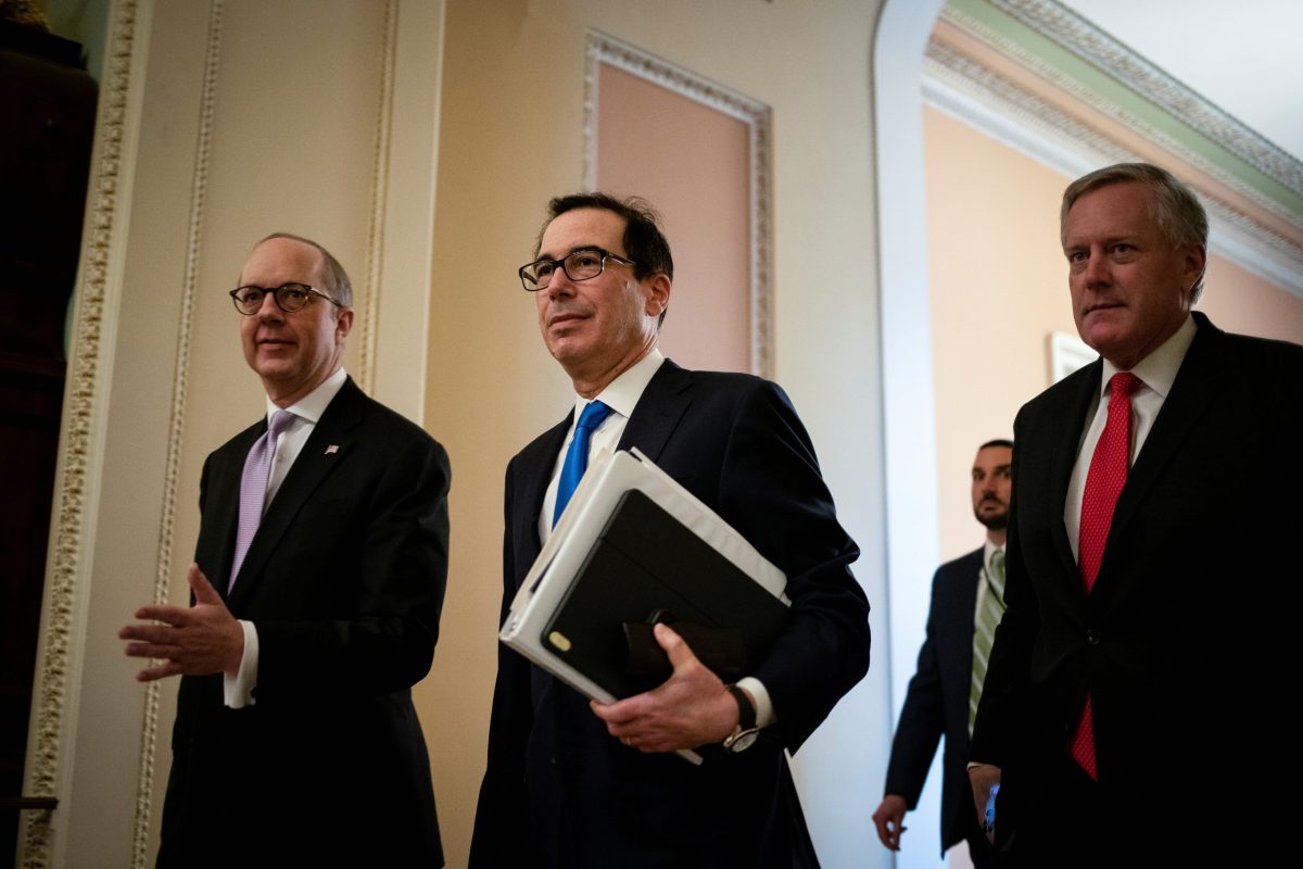 White House Legislative Affairs Director Eric Ueland, U.S. Secretary of the Treasury Steven Mnuchin, and incoming White House Chief of Staff Rep. Mark Meadows (R-NC), walk to a meeting during negotiations on a coronavirus disease (COVID-19) relief package