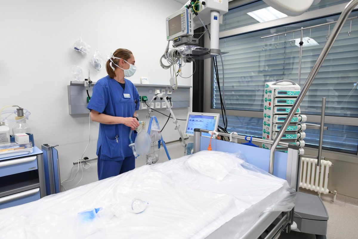 Anesthesiologist Sylvie Thierbach of the German armed forces Bundeswehr stands in front of a bed in the intensive care unit of the Ulm Bundeswehr hospital