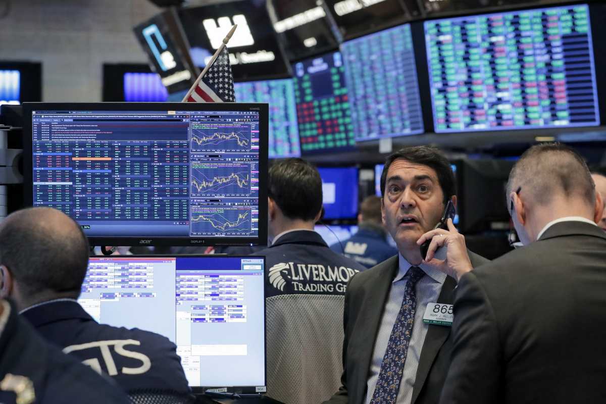 Traders work on the floor of the NYSE in New York