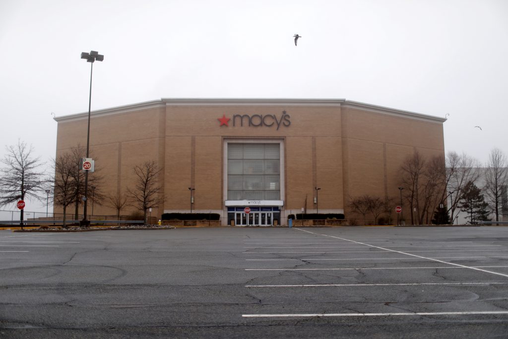 FILE PHOTO: A shuttered Macy’s store and empty parking lot are seen at the closed Palisades Center shopping mall during the coronavirus outbreak in West Nyack