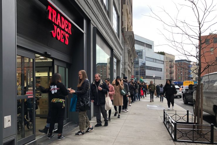 people in line in front of a Trader Joe's