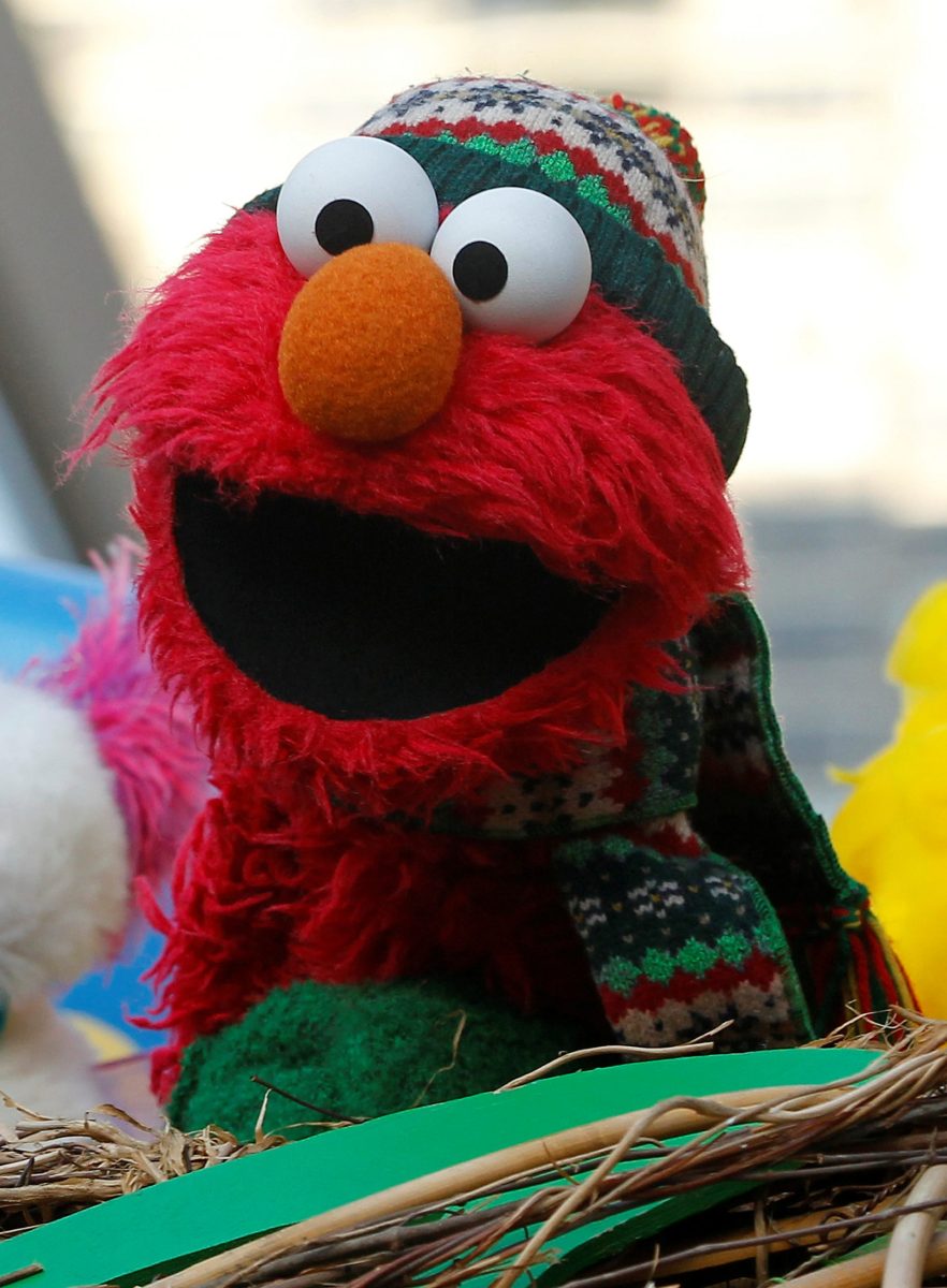 FILE PHOTO: An Elmo muppet is seen on the Sesame Street float during the 86th Macy’s Thanksgiving day parade in New York
