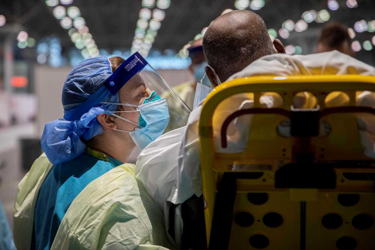 Army medic checks a patient’s information in New York